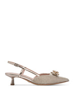 Beige high-heeled shoes with embellishments on a white background