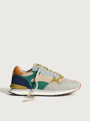 Multicolored sneaker on a light gray background